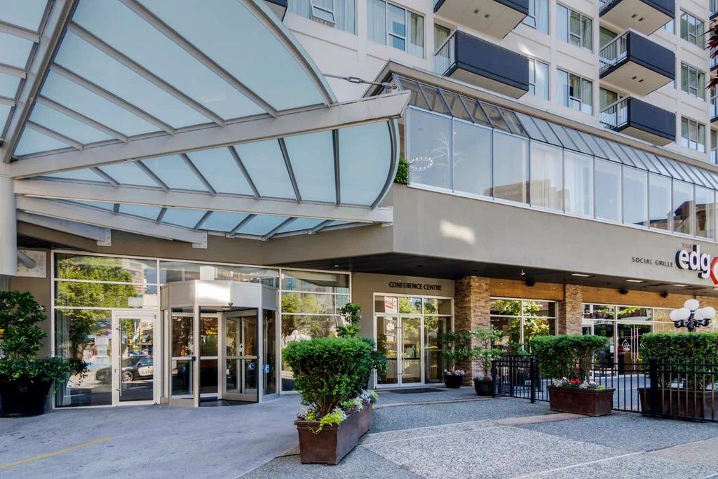Luxurious modern resort complex in Riga with elegant architectural design featuring glass facades, golden lighting accents, and sophisticated entertainment facilities at dusk